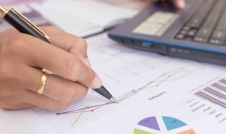 Businesswomen working with graph data at office,Finance managers task,Concept business and finance