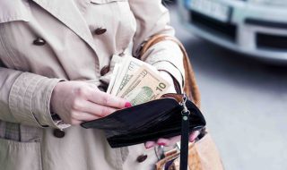 Girl is taking out money from wallet