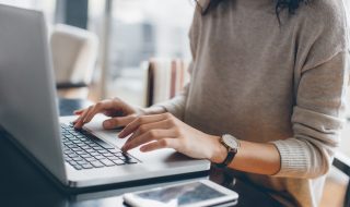 Young woman using laptop as an entrepreneur